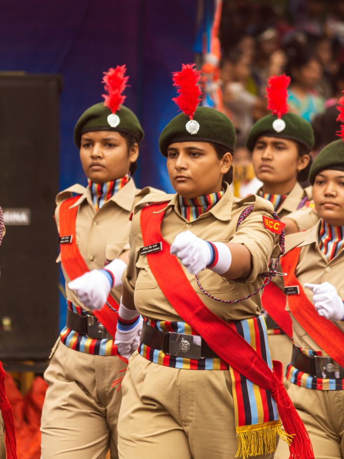 Mastering the First Impression: Your intriguing post title goes here Group of women marching in NCC uniforms during a parade in Sagar, India.