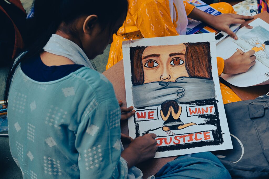 pexels photo 29897051 29897051 A young girl creates powerful protest art to raise awareness for women's justice in Kolkata, India.